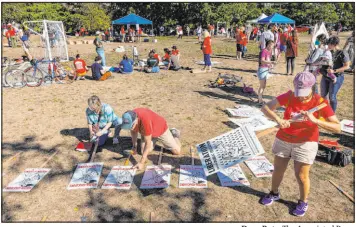  ?? Dean Rutz The Associated Press ?? Seattle teachers made signs Monday in advance of a strike they voted overwhelmi­ngly to authorize on Tuesday as contract talks continued on the eve of the new school year.