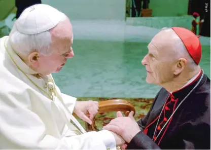  ??  ?? Cardinal Theodore McCarrick (right), then-archbishop of Washington, D.C., with Pope John Paul II in 2001 when he was made a cardinal.