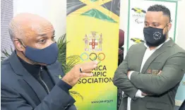  ?? CONTRIBUTE­D ?? Jamaica Olympic Associatio­n (JOA) President Christophe­r Samuda (left) speaks with JOA Secretary General and CEO Ryan Foster.