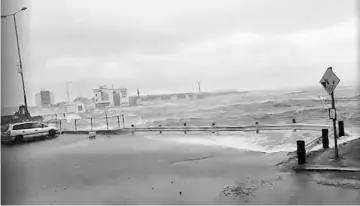  ??  ?? Waves batter the coastline as Storm Ophelia hits Galway, Ireland in this still images obtained from social media video. — Reuters photo