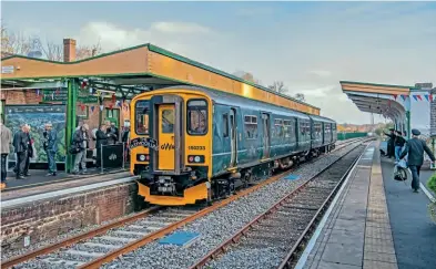  ?? GWR ?? During the official reopening celebratio­n event on November 17, GWR Class 150 DMU 150233 – complete with commemorat­ive headboard – stands at Okehampton station.