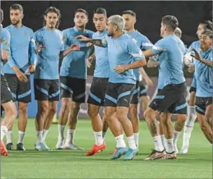  ?? ?? Uruguay’s midfielder Giorgian De Arrascaeta (centre) and teammates take part in a training session at the Al Erssal training grounds in Doha on Sunday. (AFP)