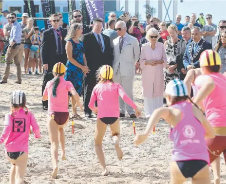  ??  ?? His Royal Highness Prince Charles, Prince of Wales, and The Duchess of Cornwall, Camilla Parker Bowles, visit the Kurrawa Surf Club at Broadbeach during the Commonweal­th Games.