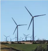  ?? Tim Boyles Photograph­y / Google ?? Windmills at a wind farm in Minco, Okla., provide Google with some of its renewable energy. The company, along with Facebook and Apple, gets high marks from Greenpeace for its renewable energy use.