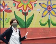  ?? MICHELLE N. LYNCH— MEDIANEWS GROUP ?? Dr. Amy Pfeiler-Wunder, a Kutztown University professor, discusses student participat­ion in a new mural on Sander Alley in Kutztown.