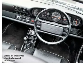  ??  ?? Classic 911 interior has chaoticall­y-placed instrument­s