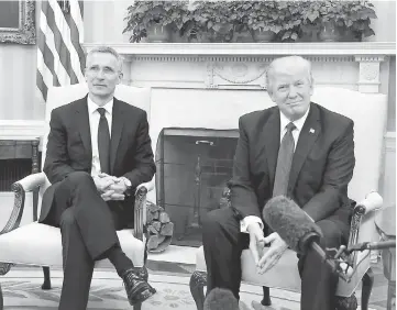  ?? — Reuters photo ?? Trump (right) meets with Stoltenber­g in the Oval Office at the White House in Washington, US.