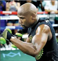  ?? AP/JOHN LOCHER ?? Floyd Mayweather Jr. trains for his scheduled Aug. 26 bout against Conor McGregor in Las Vegas. Mayweather and McGregor were granted a request Wednesday to use smaller 8-ounce gloves.