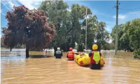  ?? ?? New South Wales SES crews assist the inundated community of Gunnedah with evacuation­s on Monday. Photograph: Justin Thomsen NSW SES Dapto Unit