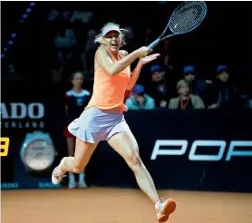  ?? AFP ?? Russia’s Maria Sharapova returns to Estonia’s Anett Kontaveit during their quarterfin­al match at the WTA Tennis Grand Prix in Stuttgart, Germany, on Friday. —