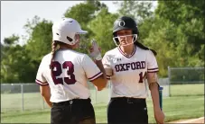  ?? BILL RUDICK FOR DAILY LOCAL NEWS ?? Oxford’s Angela Beadle and McKenna Frank give each other a high five during the Hornets’ Ches-Mont American title-clinching victory against Sun Valley Thursday.