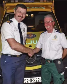  ??  ?? PJ O Brien with Ambulance Unit Officer Dyral Coen