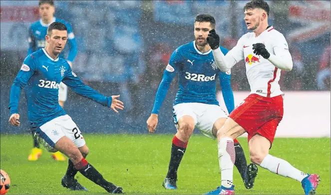  ??  ?? STARTER FOR 10: Jon Toral closes down Scotland internatio­nal Oliver Burke during a debut which impressed the Rangers manager Mark Warburton despite the onesided scoreline.