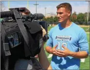  ?? MARK PODOLSKI — THE NEWS‑HERALD ?? Quarterbac­k Mitchell Trubisky is interviewe­d by ESPN during North Carolina pro day in Chapel Hill on March 21.