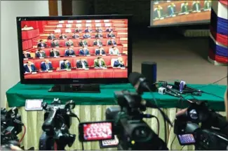  ?? PHA LINA ?? A monitor shows a session of the National Assembly on Monday. Following the controvers­ial redistribu­tion of the CNRP’s seats, the number of women in parliament has dropped.