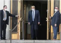  ?? EVAN VUCCI AP ?? President Donald Trump walks out of Walter Reed National Military Medical Center in Bethesda, Md., on Monday.