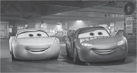  ?? PIXAR ?? Cruz Ramirez (left, voiced by Cristela Alonzo) helps Lightning McQueen (Owen Wilson) get back on the track in Cars 3.