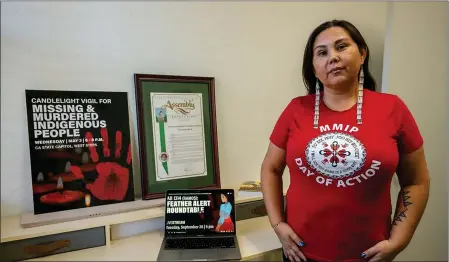  ?? RENÉE C. BYER — THE SACRAMENTO BEE ?? Morning Star Gali, executive director of the Sacramento-based nonprofit Indigenous Justice, stands with materials promoting efforts to find missing and murdered Indigenous people at her office earlier this month.