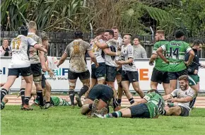  ??  ?? Old Boys celebrate after scoring.