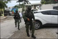  ?? ELIZABETH RUIZ — AFP VIA GETTY IMAGES FILE ?? Mexican soldiers walk outside the Hyatt Ziva Riviera hotel in Puerto Morelos, Quintana Roo state, Mexico, on Nov. 4, 2021, after a shooting. Some areas of Mexico have seen an upswing in violence and unrest.