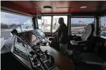  ??  ?? Port captain Donnie Mayville prepares to back the Bayou City pilot boat from a dock in Galveston for the trip back up the Ship Channel.