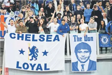  ??  ?? Chelsea’s fans cheer their team before the UEFA Champions League football match AS Roma vs Chelsea at the Olympic Stadium in Rome. — AFP photo