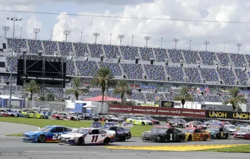 ?? Associated Press ?? Denny Hamlin (11) and Joey Logano (22) race for the lead on the road course Aug. 16 at Daytona Internatio­nal Speedway. NASCAR’s Cup Series returns Saturday night to Daytona’s oval. “A lot of people are desperate,” Logano said of the playoff chase.