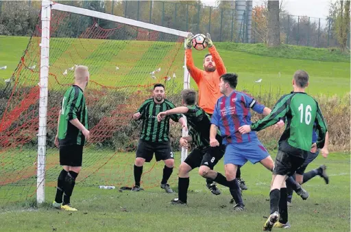  ??  ?? ●●Action from Trafford United’s game against Milton (in green)