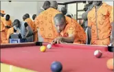  ??  ?? PASSING TIME: Inmates keep themselves busy by playing snooker at Johannesbu­rg Correction­al Centre.