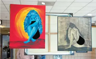  ?? — AFP photos ?? Art work by police officers are displayed during an exhibition at a Chicago police station.