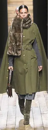  ?? — Michael Kors ?? Michael Kors’ town-and-country collection was very much inspired by equestrian elements. Paired with riding boots were a selection beautiful capes. “It’s the dream of getting out, getting away from reality,” he was reported as saying at the runway show.