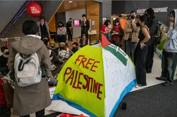  ?? Stephanie Keith/Getty Images ?? Student activists set up a protest encampment in support of Palestinia­ns inside the New School in New York City on April 21.