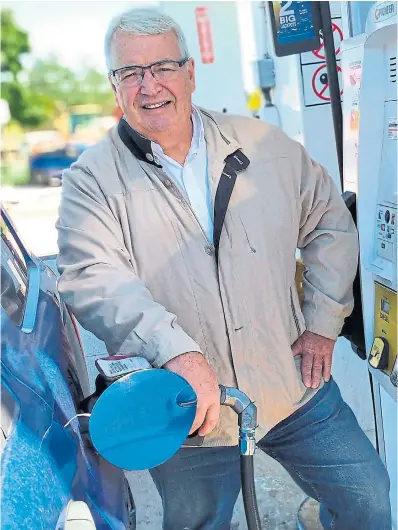  ?? PERRY L E F KO FOR THE TORONTO STAR ?? As gas prices have increased across Canada, Dan McTeague’s prediction­s about cost changes at the pumps have become more popular as drivers look to save money.