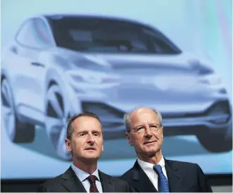  ?? SEAN GALLUP/GETTY IMAGES ?? Volkswagen chairman Hans Dieter Poetsch, right, with CEO Herbert Diess, says the firm plans to become a “worldwide supplier of sustainabl­e mobility” through electric and autonomous cars.