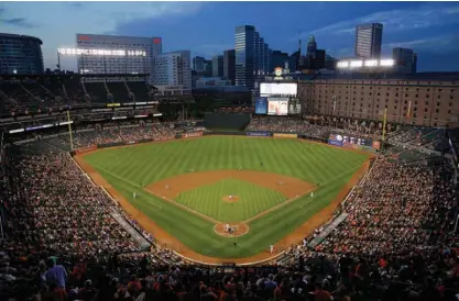  ?? Associated Press ?? n The Toronto Blue Jays and Baltimore Orioles play in the fourth inning of a baseball game May 11, 2015, in Baltimore. It's been 25 years since the Baltimore Orioles began playing in Camden Yards, the start of a nationwide trend of major league teams...