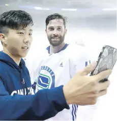  ??  ?? Backup goaltender Taylor Sun, who signed an amateur tryout contract with Vancouver, has joined Erik Gudbranson and the rest of the Canucks for this week’s pre-season games in China, serving as the team’s third goalie.