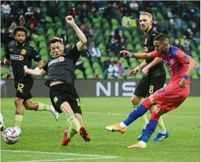  ?? — Reuters ?? Fit for the job: Chelsea’s Hakim Ziyech scores their third goal against Krasnodar in the Champions League match.