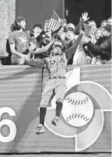  ?? GREGORY BULL/AP ?? United States outfielder Adam Jones makes a catch above the wall for the out on the Dominican Republic’s Manny Machado during a World Baseball Classic game in San Diego on March 18, 2017. The U.S. won that most recent edition of the World Baseball Classic.