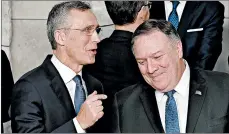  ?? JOHN THYS/GETTY-AFP ?? NATO Secretary-General Jens Stoltenber­g, left, speaks with Secretary of State Mike Pompeo on Tuesday.