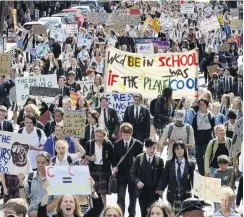  ?? PHOTO: GERARD O’BRIEN ?? In voice . . . Striking high school pupils and supporters march up George St to the Octagon last Friday to protest inaction on climate change.