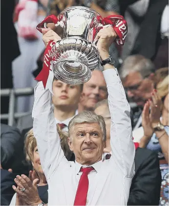  ??  ?? All smiles: Arsene Wenger enjoys Saturday’s 2-1 FA Cup Final victory over Chelsea at Wembley.