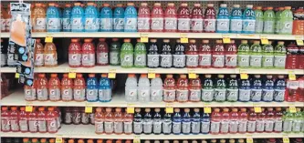  ?? DREAMSTIME ?? Researcher­s have found an increase in the weekly consumptio­n of high-carb sports drinks among teens.