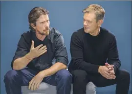  ?? Jay L. Clendenin Los Angeles Times ?? CHRISTIAN BALE, left, and Matt Damon discuss their film, “Ford v Ferrari.” “I think you don’t have to give a damn about cars at all,” Bale says of the movie.