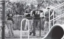  ?? THE ASSOCIATED PRESS ?? FBI agents investigat­e a playground near the baseball field in Alexandria, Va., on Thursday, where House Majority Whip Steve Scalise was shot during a congressio­nal baseball practice Wednesday.