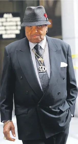  ?? PHOTO: REUTERS ?? Joe Jackson leaves court in Los Angeles during the 2011 trial over the death of son Michael.
