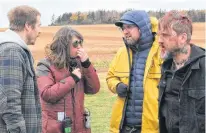  ?? SPECIAL TO SALTWIRE NETWORK BY KELLY CASELEY ?? The cast and crew of the movie A Small Fortune talks about the next scene while filming the movie in French River, P.E.I., in 2019. From left, are lead actor Stephen Oates, assistant director T. Nicole Holland, director Adam Perry and actor Joel Thomas Hynes.
