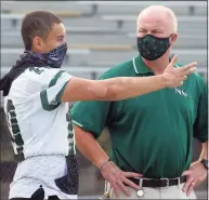  ?? Ned Gerard / Hearst Connecticu­t Media ?? Norwalk High quarterbac­k Tommy Brown speaks with school athletic director Doug Marchetti.