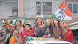  ?? AFP ?? Congress supporters wave flag after the election results were out in Imphal on Saturday.