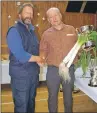  ??  ?? Maurice Wilkins congratula­tes Ritchie Robb for his winning leeks