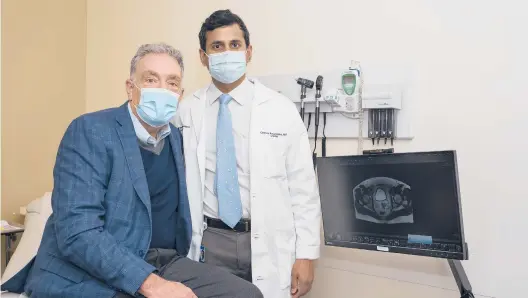  ?? YOUNGRAE KIM/THE NEW YORK TIMES ?? Matthew Curtin, who learned he had prostate cancer in 2019, is seen Dec. 2 with Dr. Channa Amaraseker­a at Northweste­rn Memorial Hospital in Chicago.